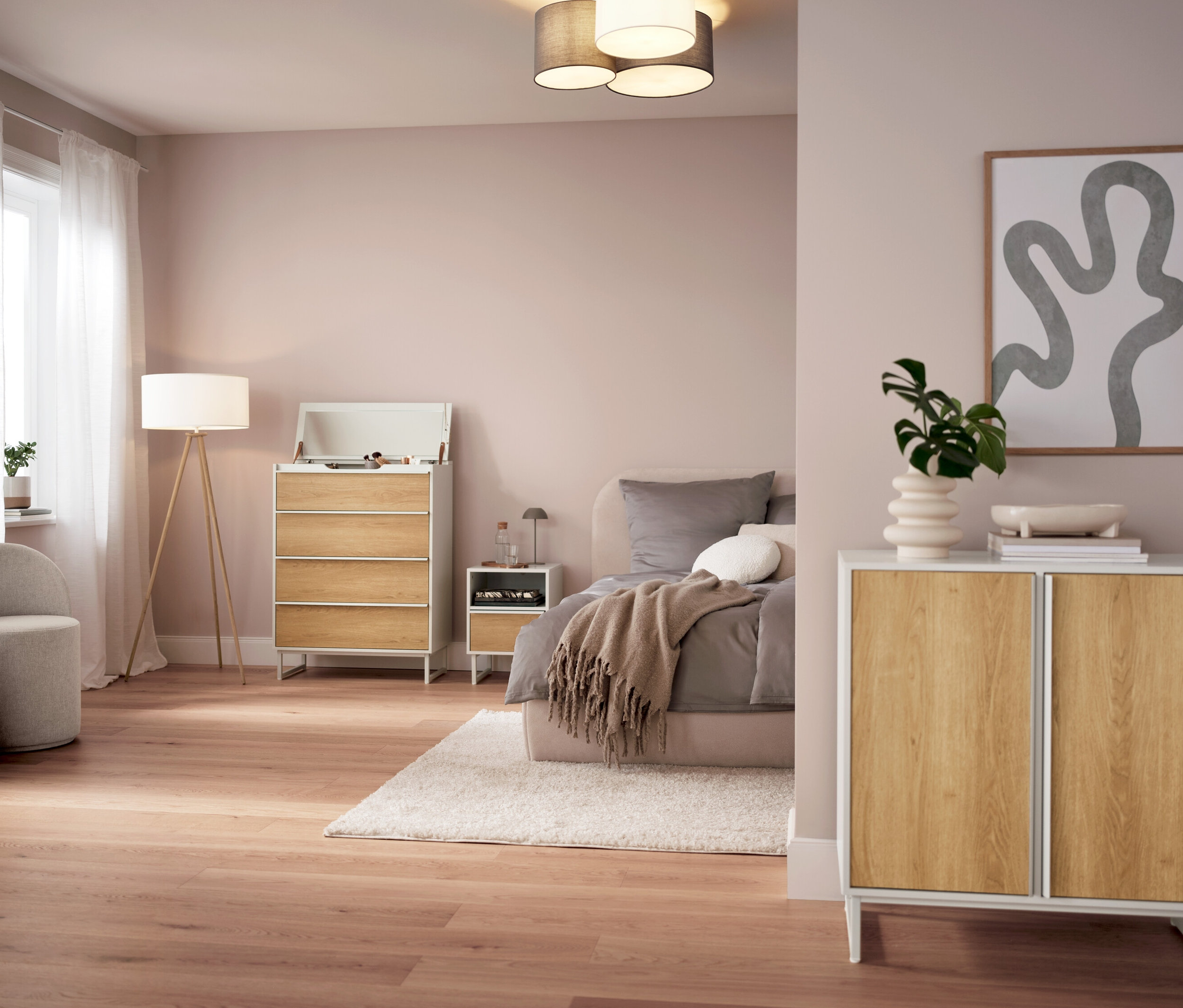 Chambre avec lampe de table rechargeable à LED grise sur la table de chevet.