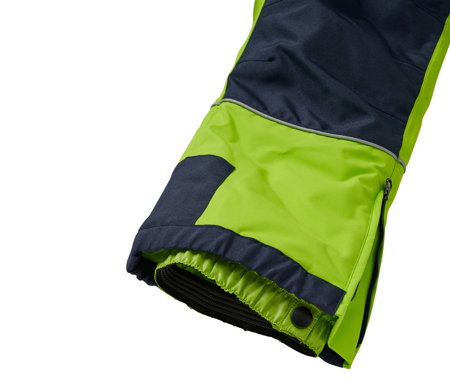 Pantalon combinant bleu marine et vert néon avec une fermeture éclair