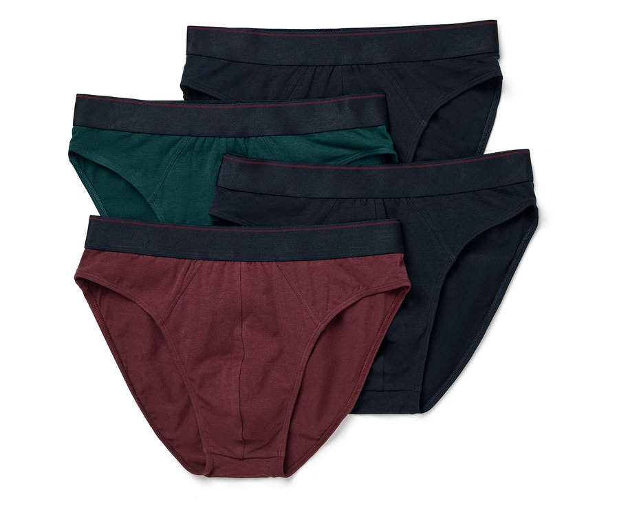 Cinq slips pour hommes en bleu foncé, vert et bordeaux sont posés les uns sur les autres.