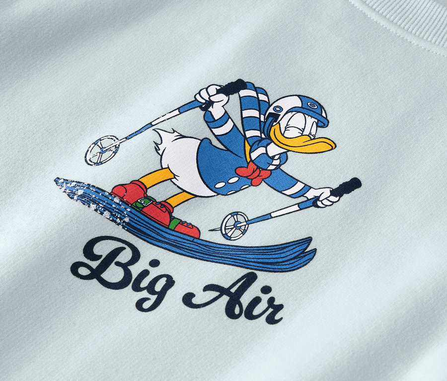 Personnage de dessin animé de Donald Duck sur des skis avec l'inscription "Big Air".