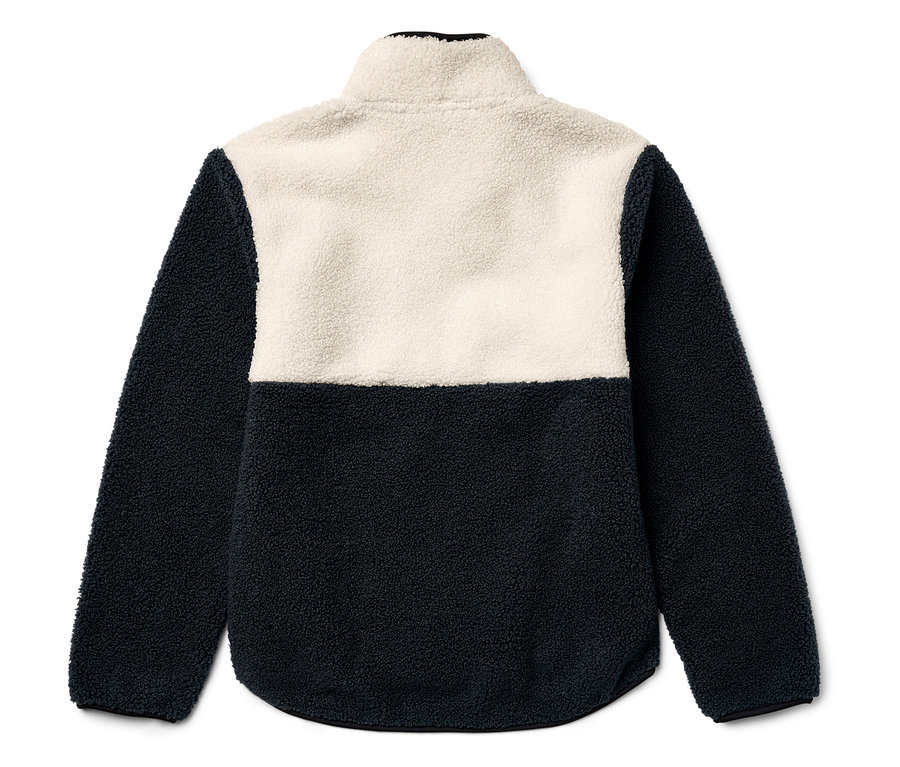 Veste en polaire bicolore avec fermeture éclair courte, partie supérieure crème, partie inférieure bleu foncé.