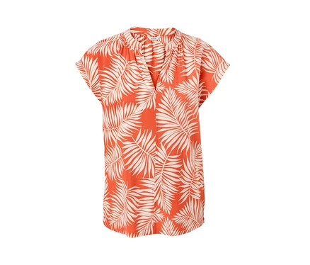 Chemisier imprimé orange à manches courtes avec motif de feuilles.