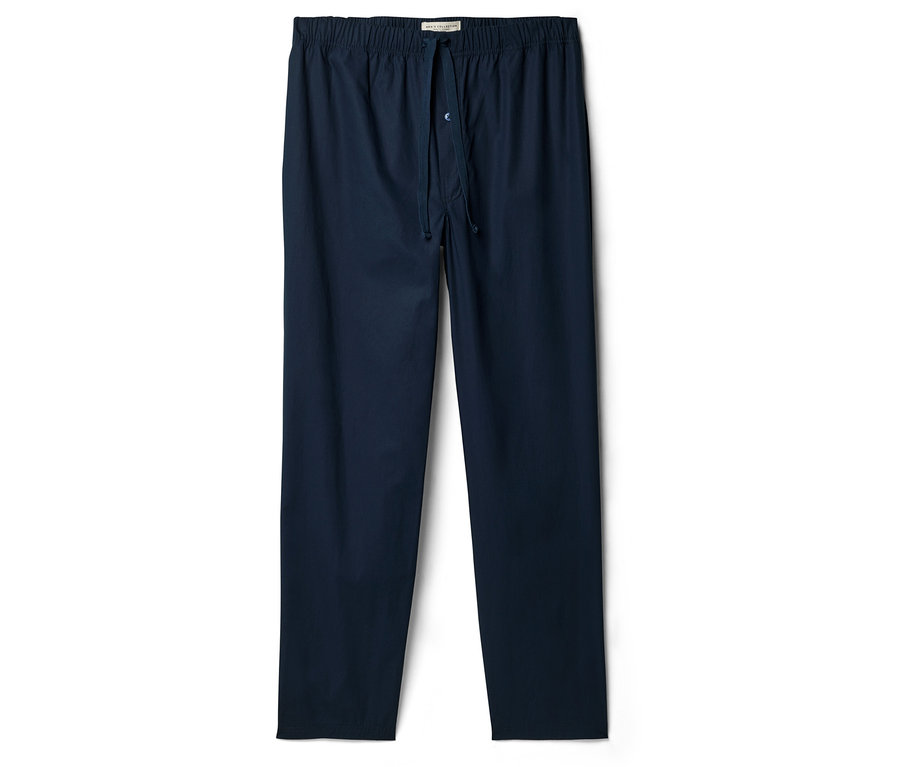 Pantalon de pyjama bleu marine avec cordon de serrage et fermeture boutonnée.
