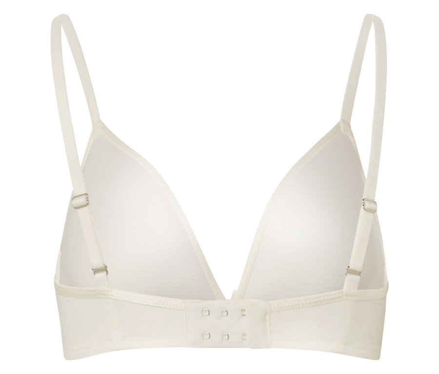 Gros plan sur l'arrière d'un soutien-gorge blanc avec bretelles réglables et fermeture à agrafes.