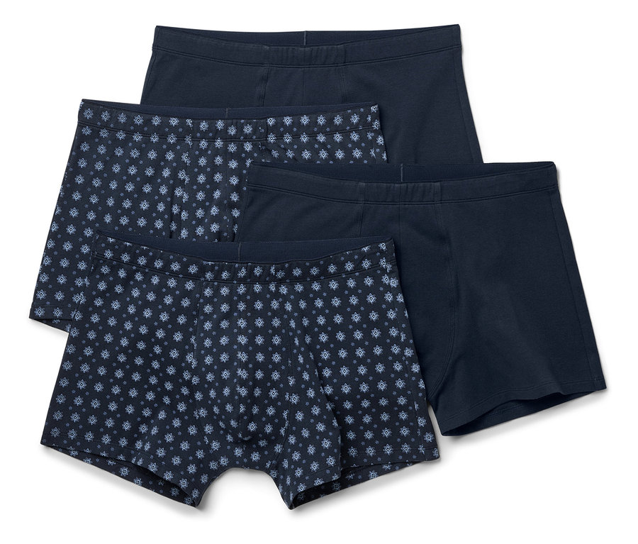 Quatre boxers bleu marine, deux unis, deux avec un motif bleu.