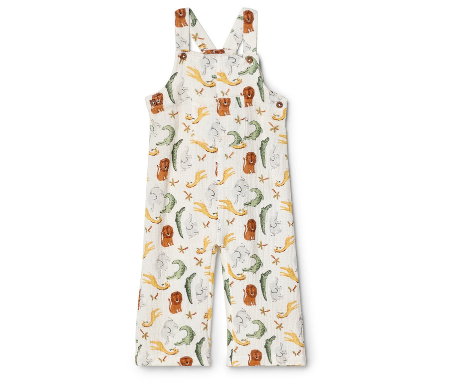 Salopette blanche à motifs crocodile, lion et étoile.