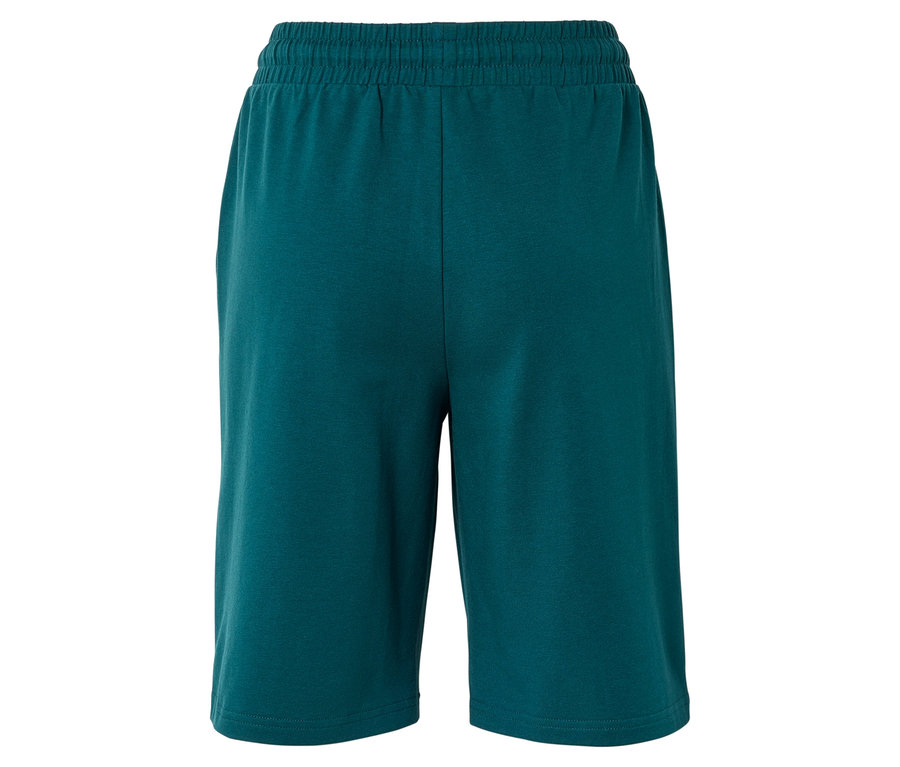 Gros plan sur un short turquoise avec une ceinture élastique, photographié de dos.