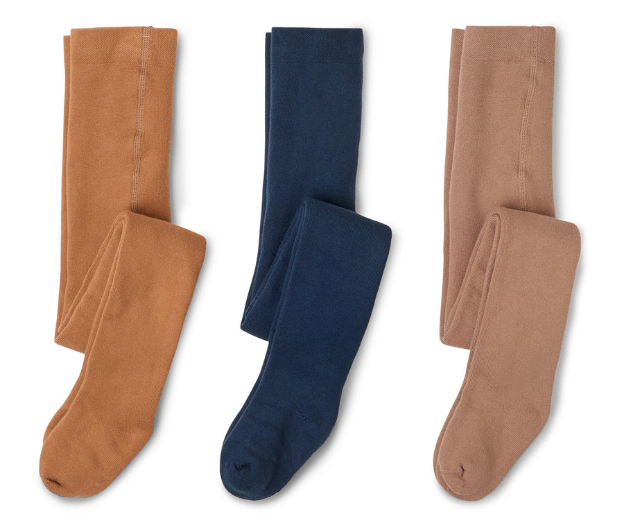 Trois paires de collants dans les tons marron, bleu foncé et marron clair sont posées sur un fond blanc.