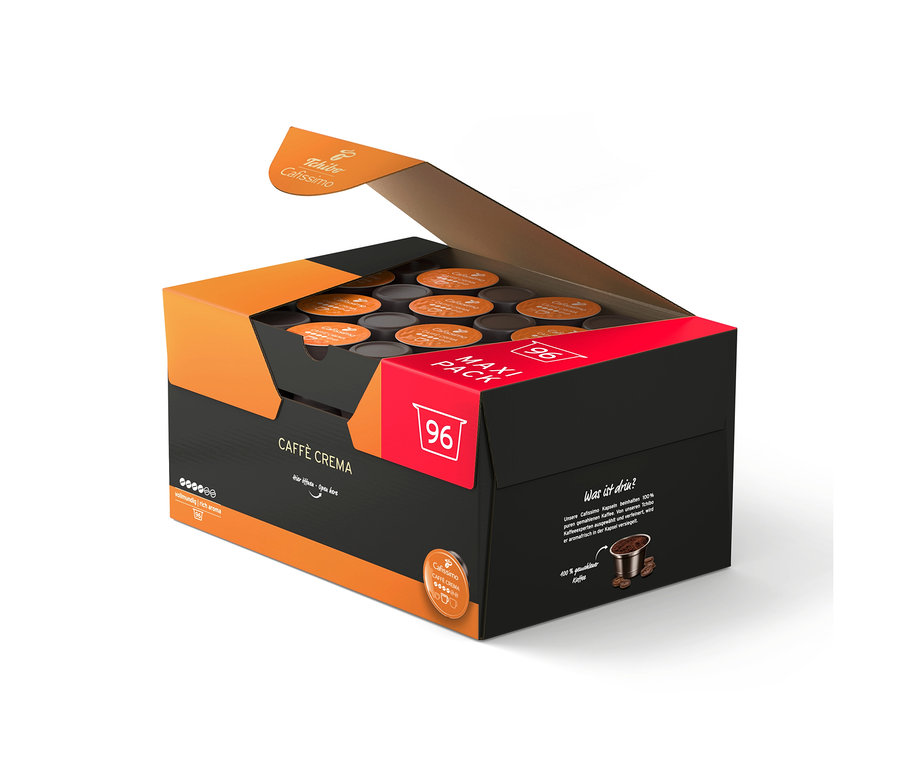 Boîte noire et orange ouverte contenant 96 capsules de café Tchibo Cafissimo Caffè Crema vollmundig.