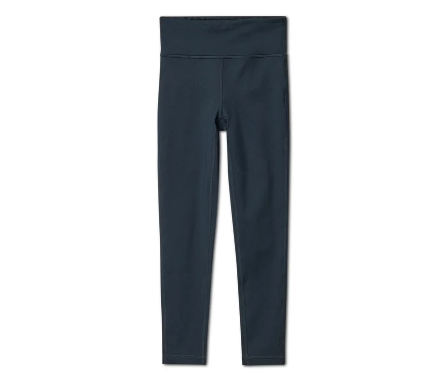 Legging taille haute bleu foncé, posé à plat sur un fond blanc.