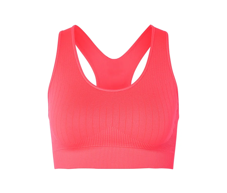 Gros plan d'une brassière de sport côtelée corail avec un dos nageur sur fond blanc.