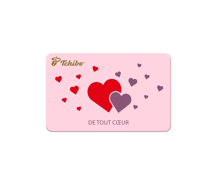 Carte rose décorée de cœurs rouges et violets, avec deux grands cœurs superposés au centre, le logo Tchibo et le texte « DE TOUT CŒUR ».