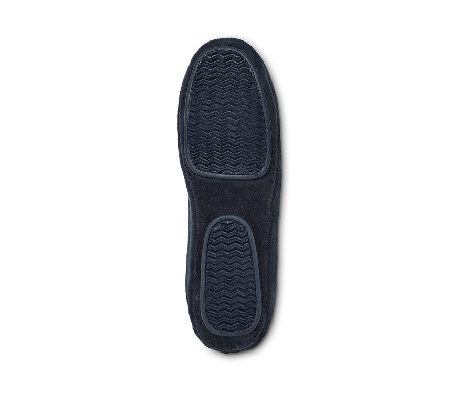 Vue détaillée de la semelle d'un chausson avec motif antidérapant.