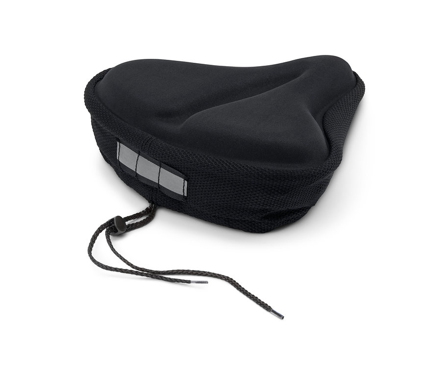 Une housse de selle noire en mousse à mémoire de forme est posée sur un fond blanc.