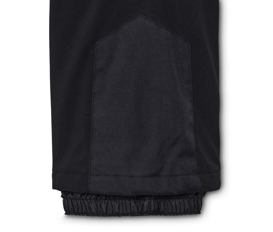 Gros plan sur un pantalon de ski taille haute noir.
