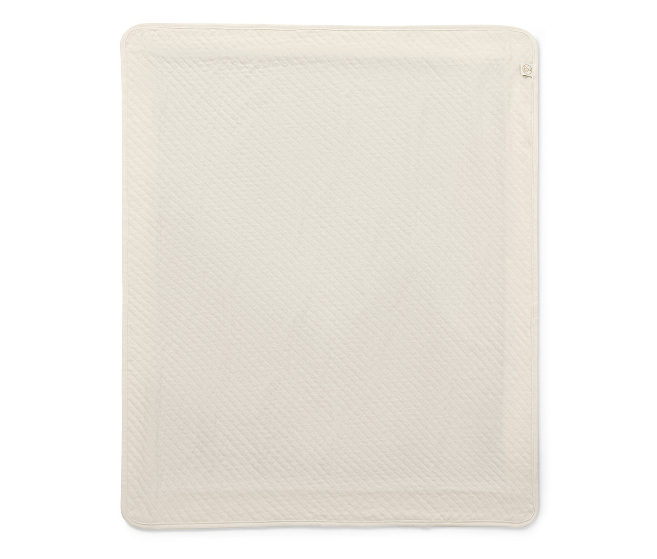 Une couverture de protection contre les rayonnements beige matelassée est posée sur un fond blanc.