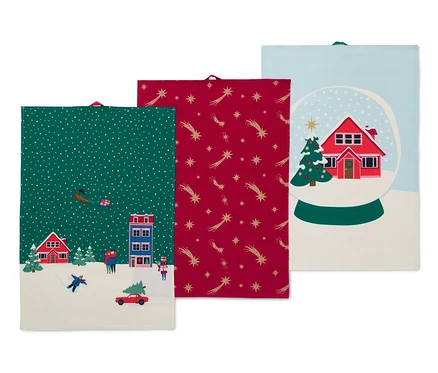 Trois linges de cuisine avec des motifs de Noël.