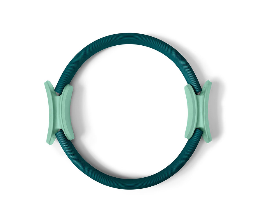 Un anneau de Pilates vert avec des poignées vert clair.