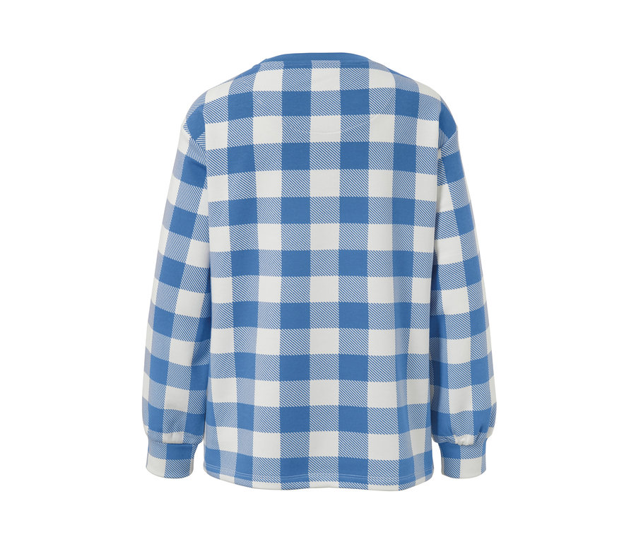Détail d'un sweat-shirt à carreaux.