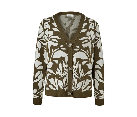 Cardigan vert en grosse maille à motif jacquard avec des feuilles blanches.