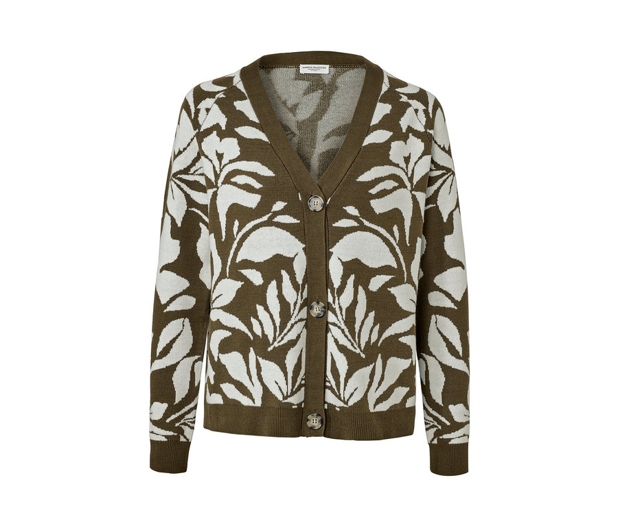 Cardigan vert en grosse maille à motif jacquard avec des feuilles blanches.