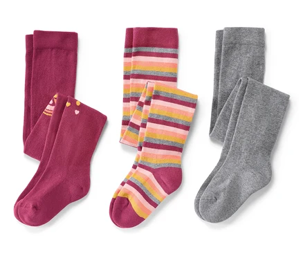 Trois paires de collants pour enfant, rose, sur fond blanc.
