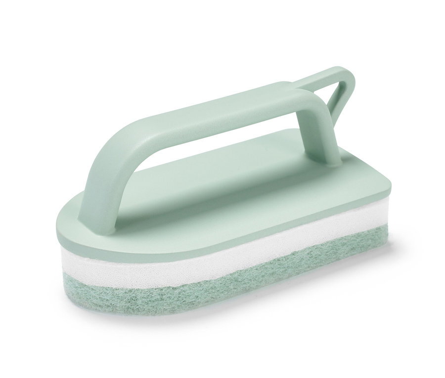 Outil de nettoyage pour carrelage vert clair avec une éponge blanche au centre.