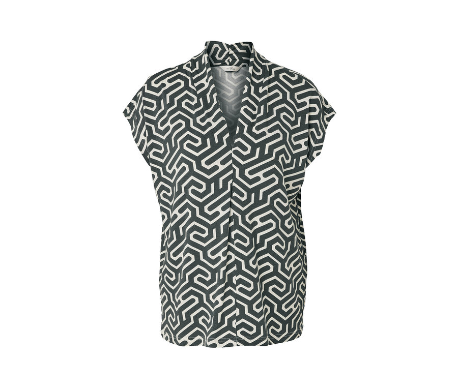 Blouse verte avec encolure en V et motif.