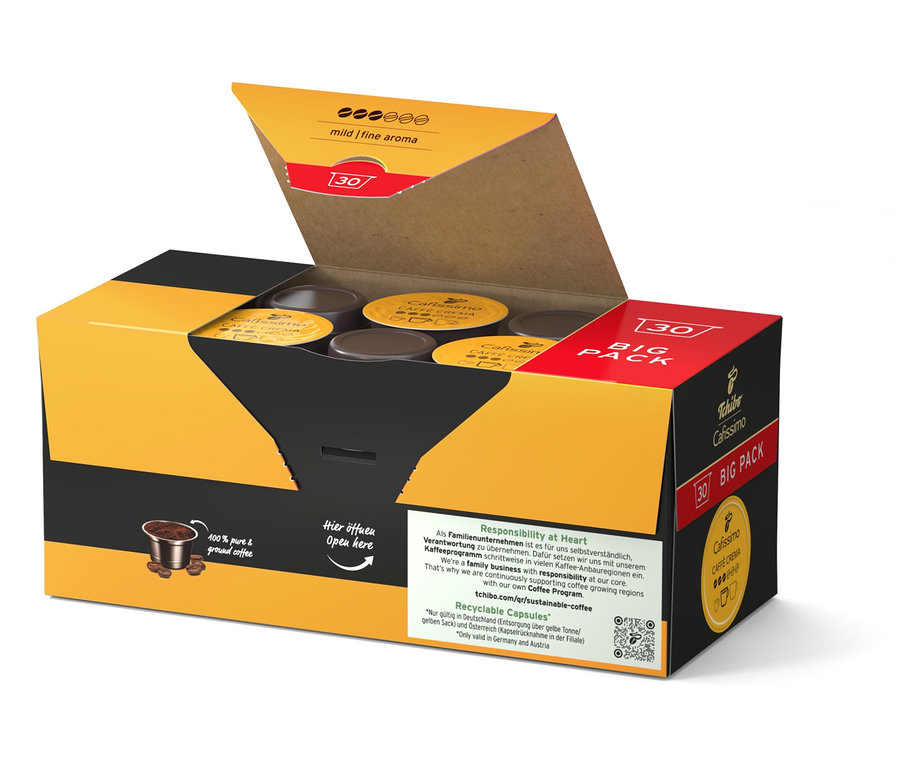 Boîte jaune et noire ouverte contenant des capsules de café.