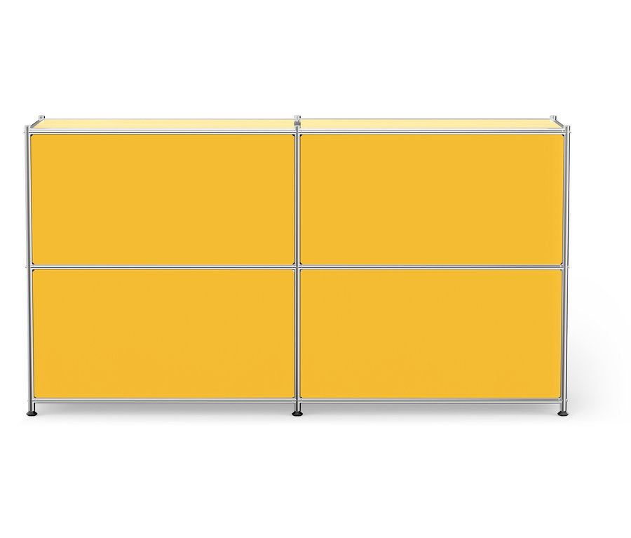 Un meuble de rangement jaune avec quatre compartiments et un cadre argenté.