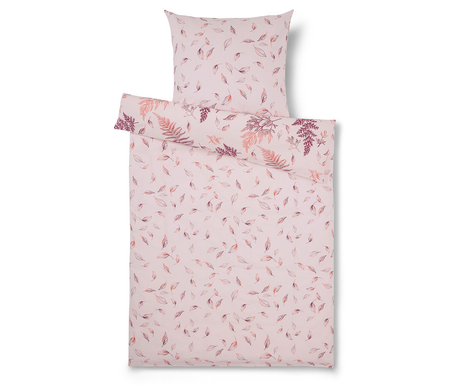 Linge de lit rose clair avec imprimé de feuilles et de fougères.