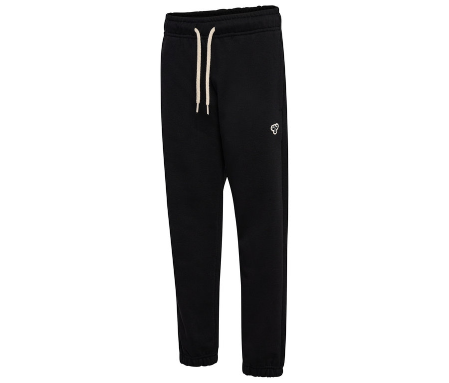 Le pantalon de survêtement ample hummel® HMLJR Bee, noir, est posé. Il a un cordon et un logo.