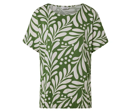 Un t-shirt vert avec un motif de feuilles et de points blancs.
