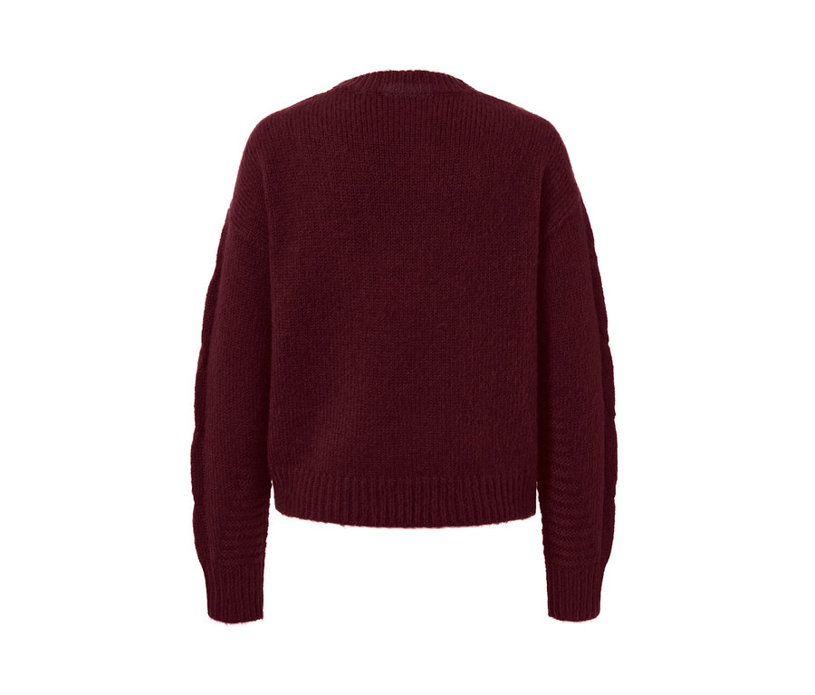 Vue détaillée d'un cardigan avec torsades.