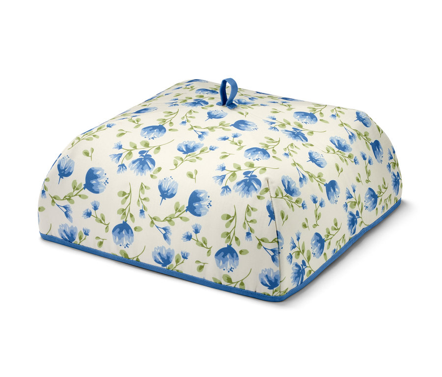 Couverture isotherme avec motif floral bleu sur fond blanc.