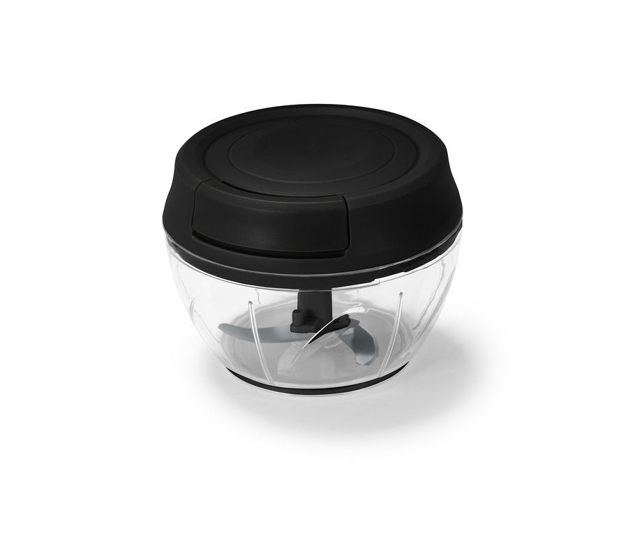 Gros plan d'un broyeur polyvalent manuel avec un dessus noir et un récipient transparent.