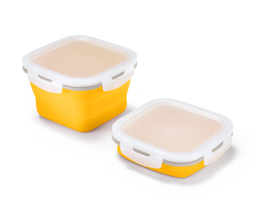 Deux boîtes fraîcheur pliables jaunes avec des couvercles blancs.