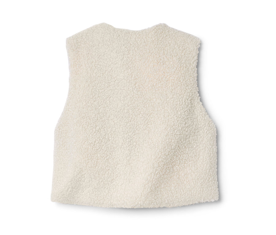 Vue détaillée d'un gilet sans manches enfant en polaire teddy de couleur crème.