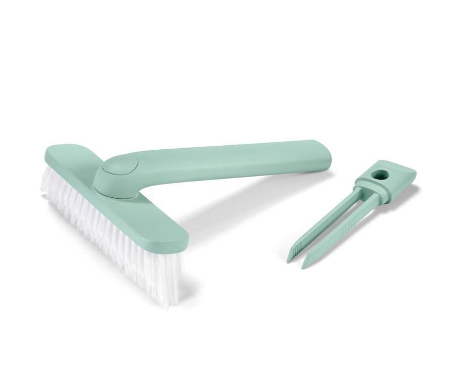 Un outil pour joints 4 en 1 vert avec une brosse et un outil pour enlever la saleté.