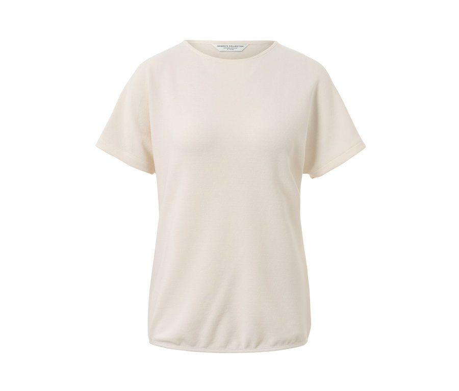 Blouse blanc-crème.