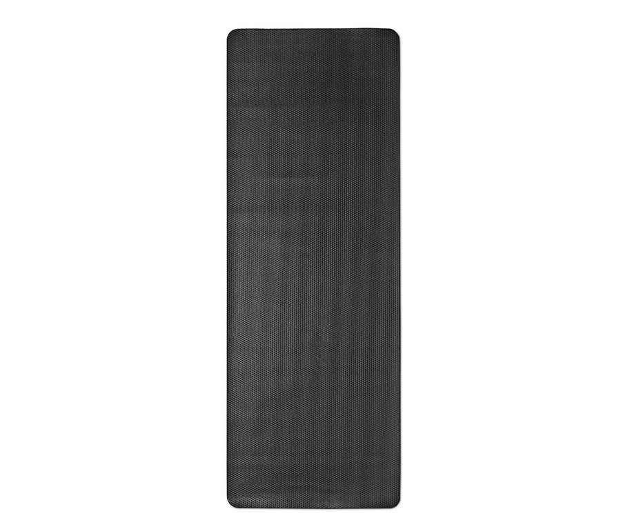 Un tapis de yoga et de fitness noir.