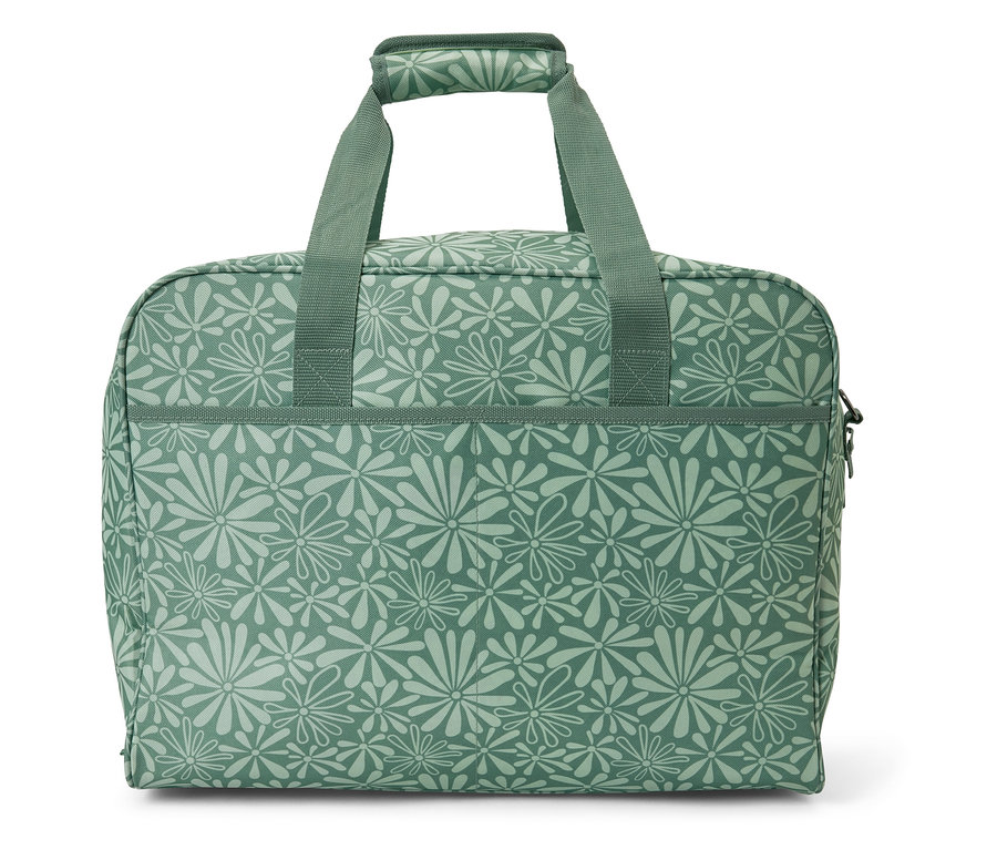 Sac de machine à coudre vert avec motif floral.