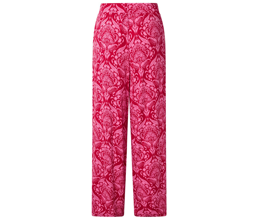Un pantalon long rouge avec un motif floral rose clair.