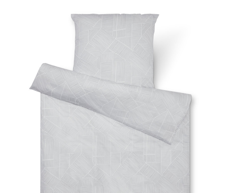 Ensemble de literie avec motif géométrique en gris et blanc, comprenant une taie d'oreiller, une couette et un rouleau.
