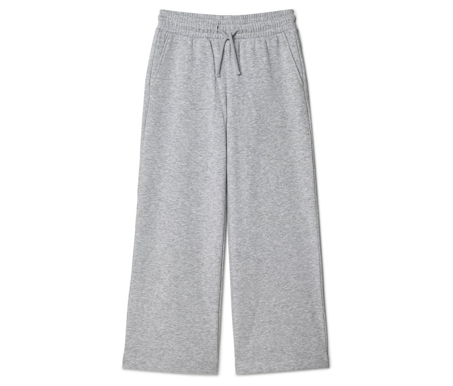 Pantalon de survêtement gris large avec cordon de serrage et poches, posé sur fond blanc.