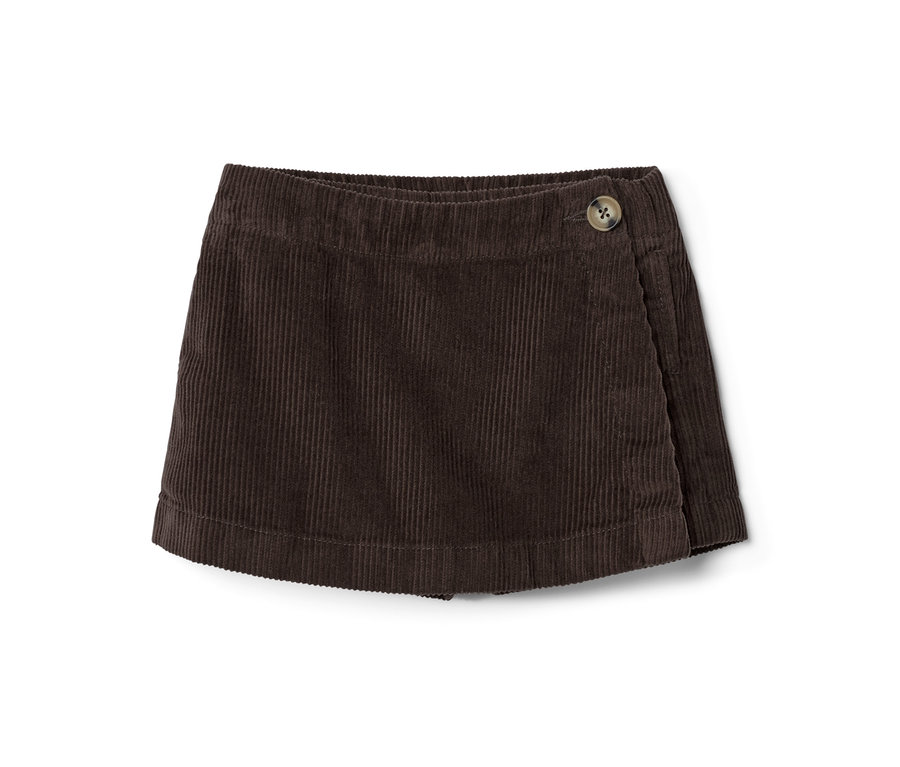 Une jupe-culotte marron en velours côtelé pour tout-petits avec un bouton.