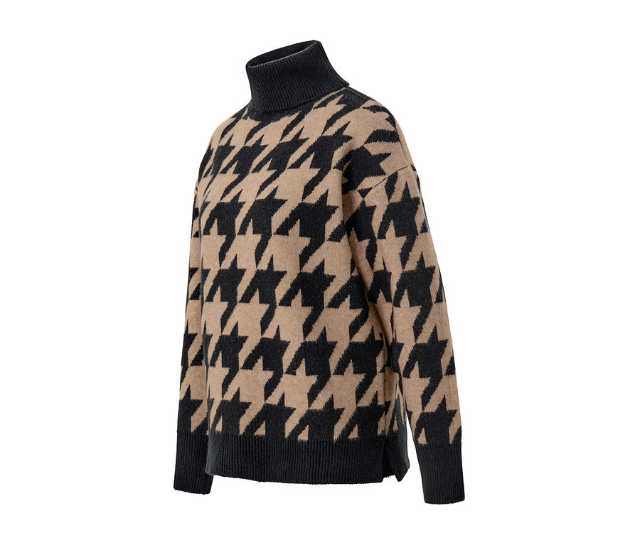 Gros plan d'un pull en maille à jacquard pied-de-poule.