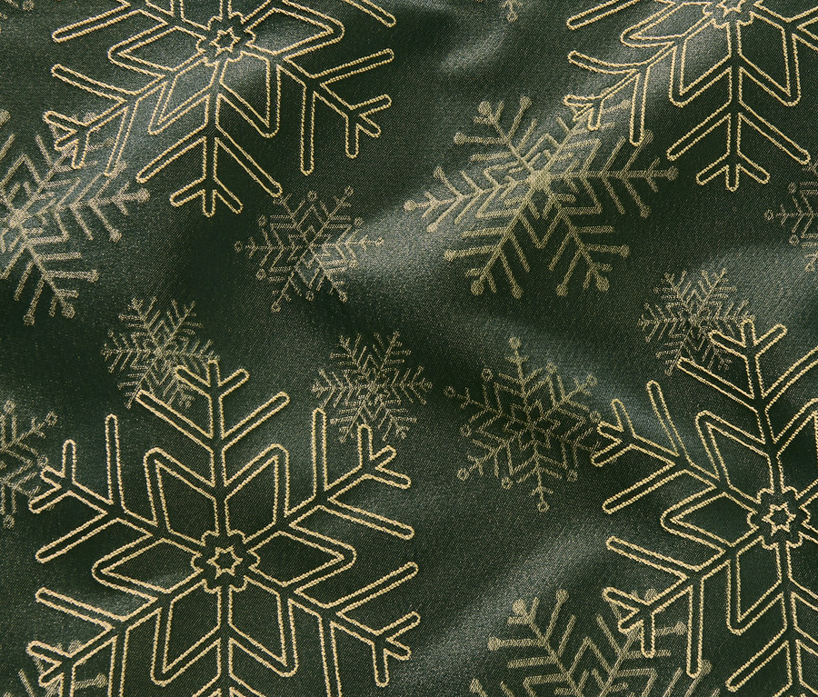Gros plan sur une nappe en jacquard avec un motif de flocons de neige.