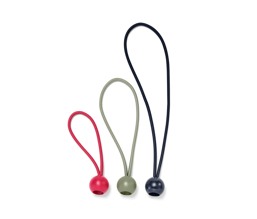 Trois tendeurs en caoutchouc avec boule en rouge, vert et noir.