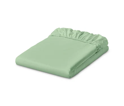 Un drap-housse en jersey vert clair est plié.